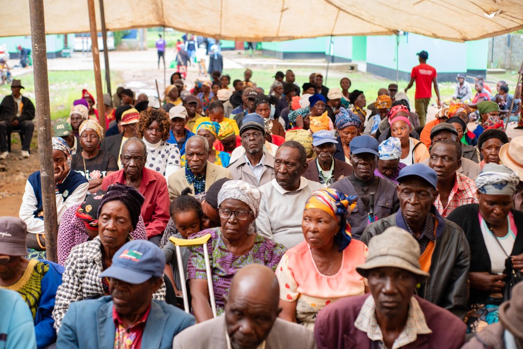 Elderly community members gathered at the Christmas hamper distribution day