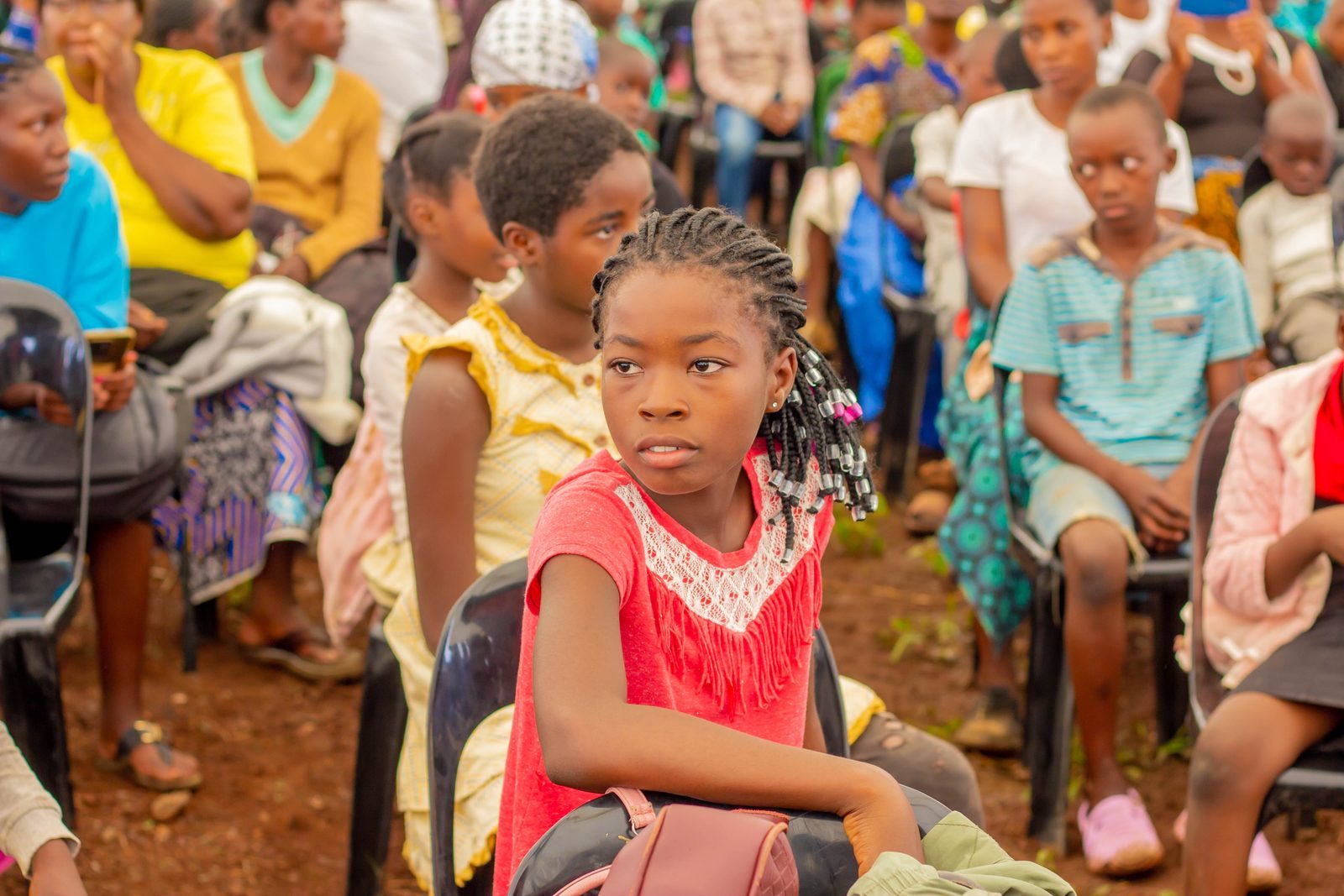 A member of the community waiting at a Oyate Zambia outreach event