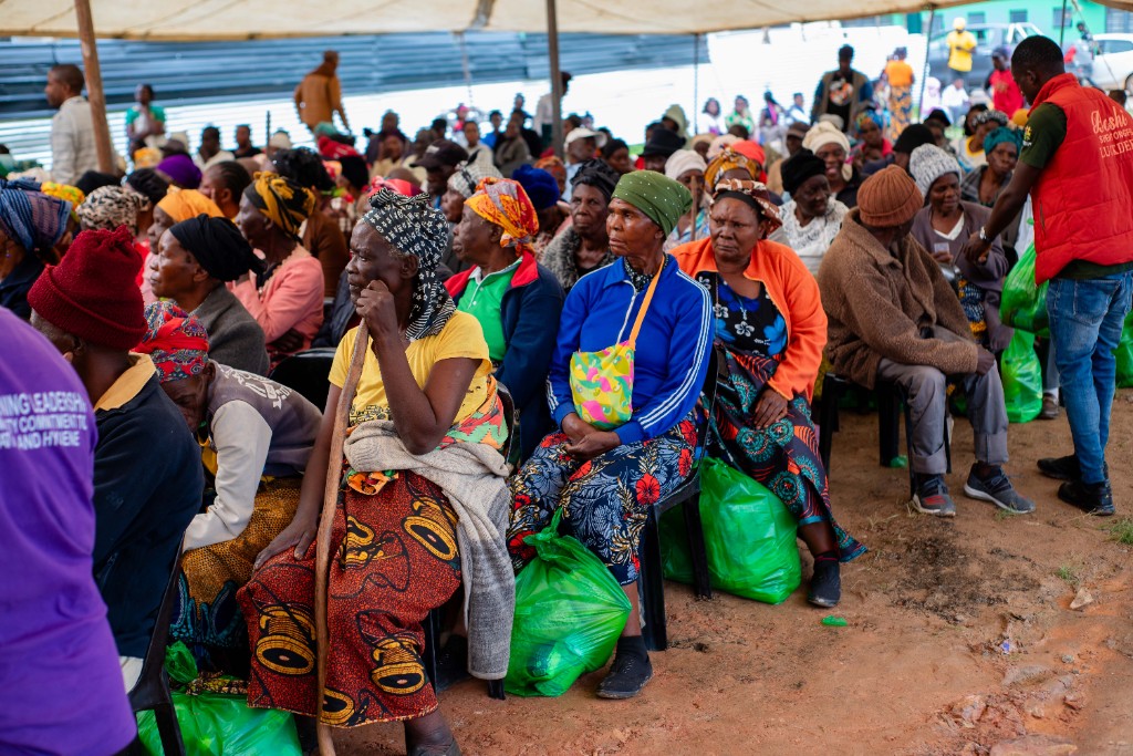 Large crowd gathered for the elderly Christmas hamper distribution